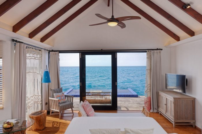 Reef-Pool-Water-Villa---Bedroom-overlooking-oceanview
