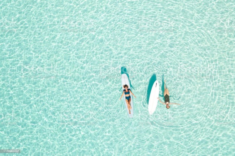 Two Women on Paddle Board in Blue Ocean, Maldives